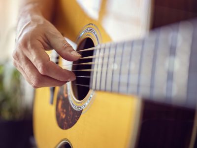 Man playing an acoustic guitar